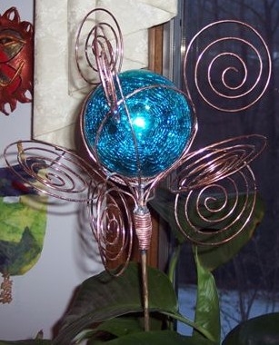 "CIRCLING" 5" GLASS BALL AND COPPER, SOLD