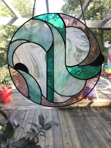 "BLOOMING" HANGING GLASS PIECE 16 INCH CIRLCE $299.00